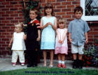 Five children standing in a line. 