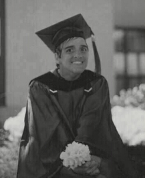 Denise Ghizzone received her Associates Degree in English in 1999.  She is pictured her in her graduation attire.