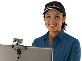 The tracking device attached to a computer tracks a reflective dot built into the user's baseball cap.